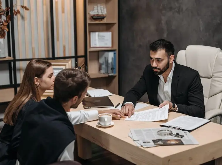 a tax preparer is discussing tax options with clients